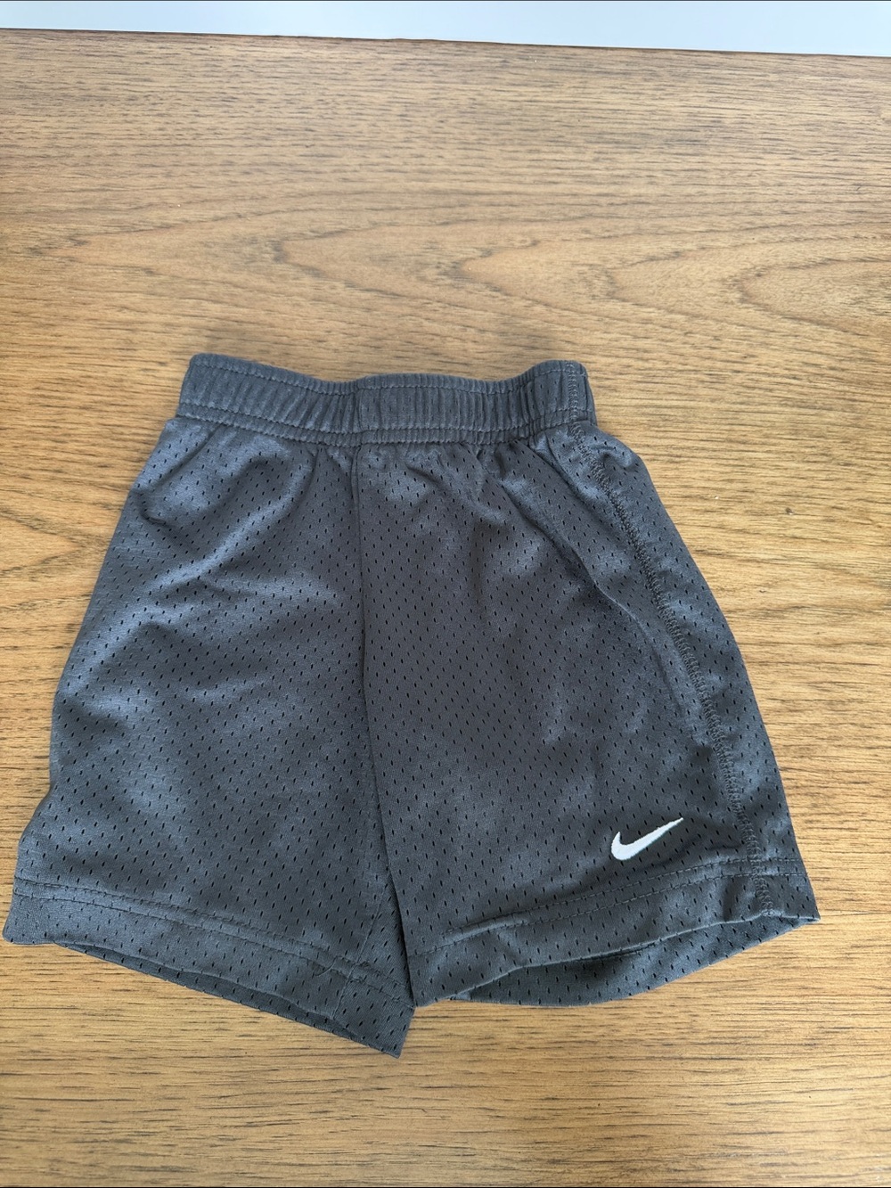 Nike Black Mesh Kids Athletic Shorts with White Swoosh